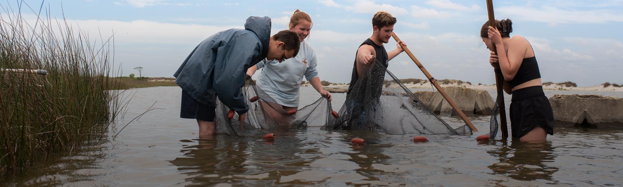 Stokes School of Marine and Environmental Sciences students doing work in Mobile Bay