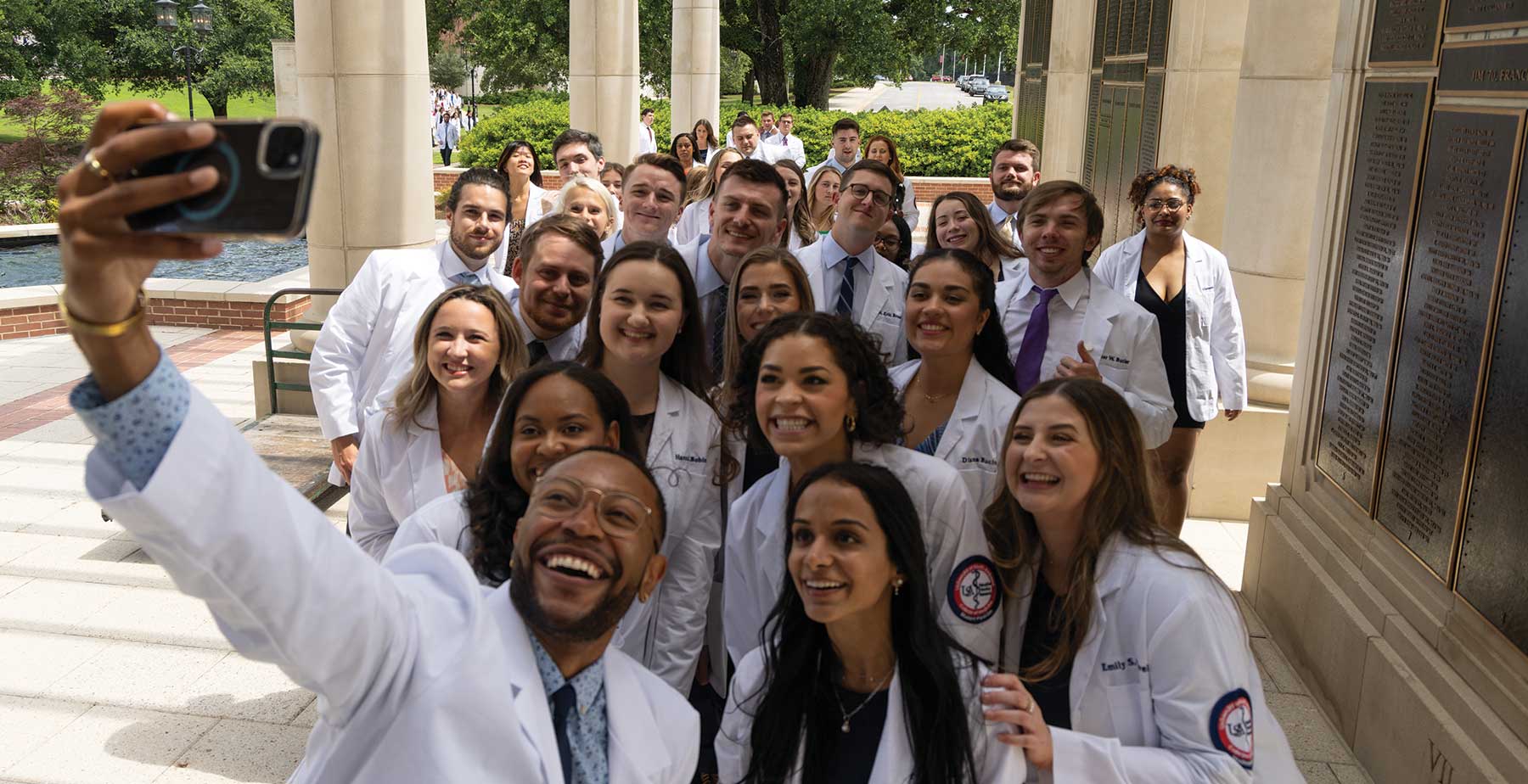 University of South Alabama College of Medicine Graduates take a group selfie