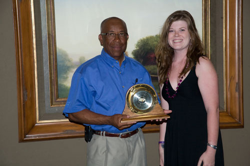 Richard Benjamin (left) of ExxonMobil presents the ExxonMobil Academic Award to Christina Holt, the 2009 outstanding senior in meteorology.