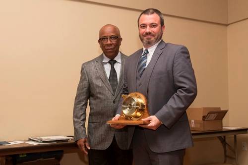 Scott Elmore receives the 2016 ExxonMobil Academic Award from Richard Benjamin of ExxonMobil.