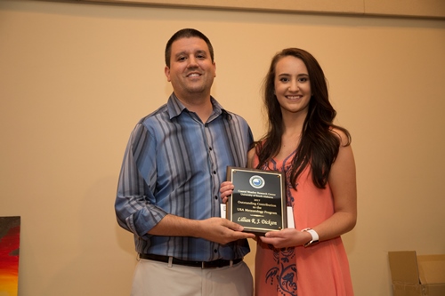 Lilly Dickson accepts the Outstanding Contribution Award from Andrew Murray.