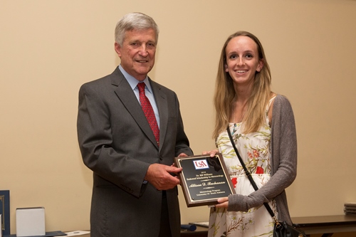 Dr. Bill Williams presents an Endowment Scholarship to Allison Buchanan.