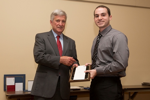 Dr. Bill Williams presents an Endowment Scholarship to Damian Bonifay.