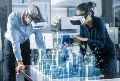 A male and female doing virtual reality in lab.