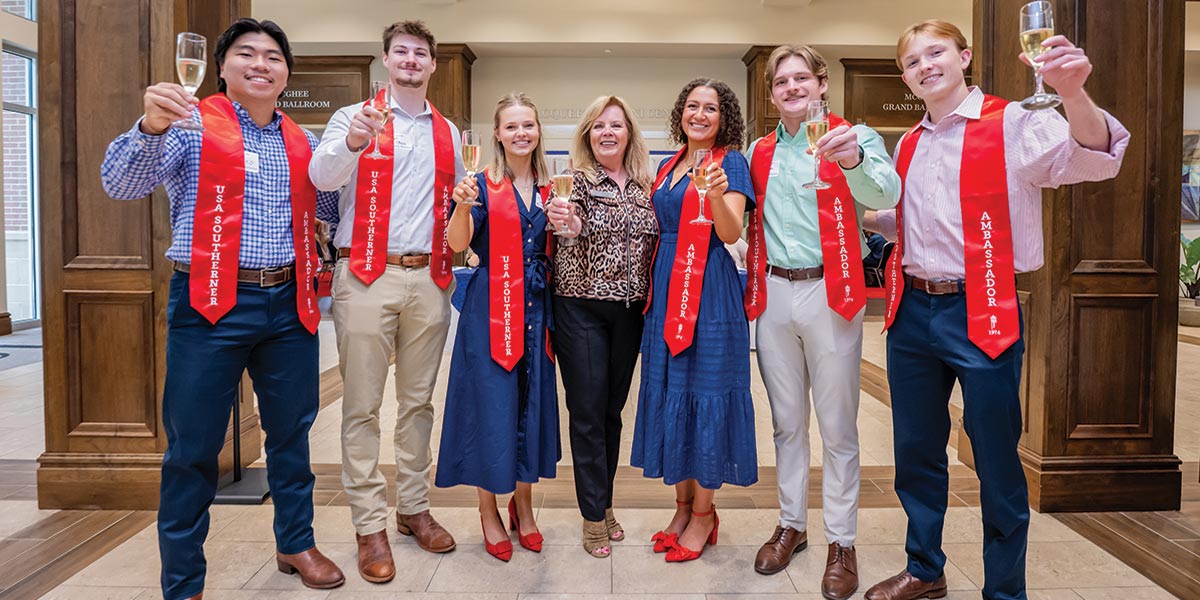 Champagne toast of graduates at Alumni Center data-lightbox='featured'
