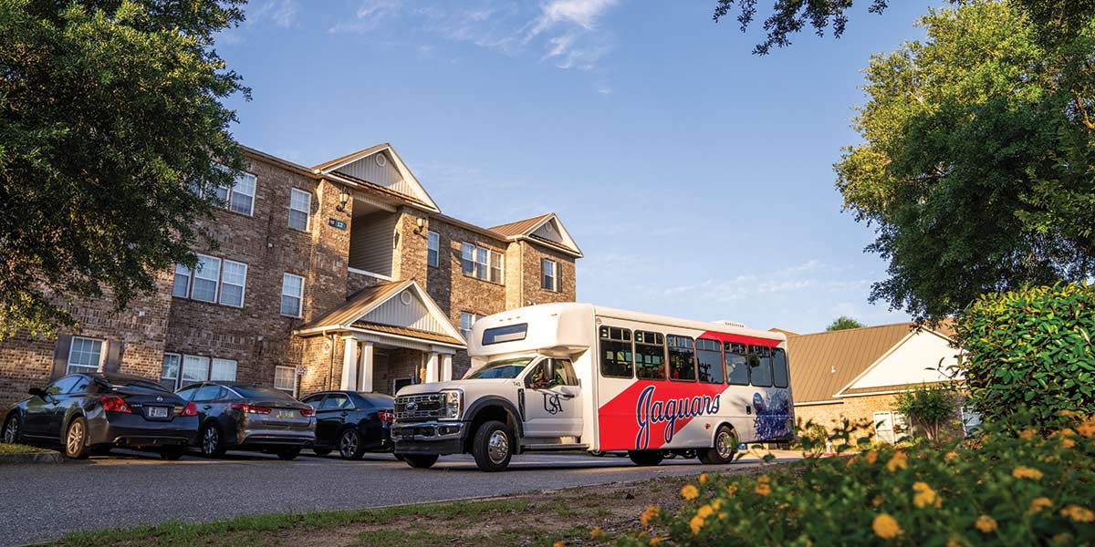 Jag bus in front of SouthPaw Village. data-lightbox='featured'