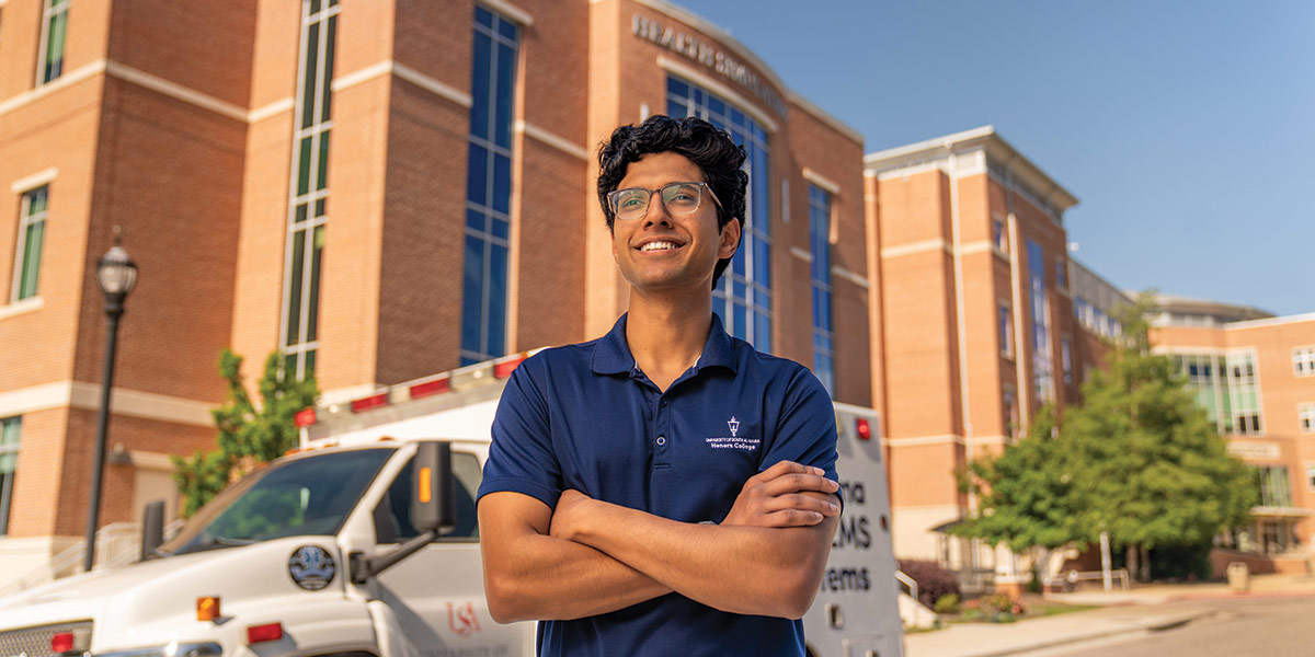 Suhas Patil standing in front of Allied Health building. data-lightbox='featured'