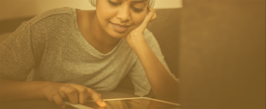 Female working on tablet.