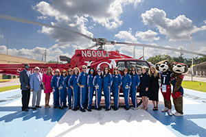 SouthFlight flight crew in front of helicopter.