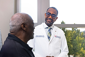 USA Health Health Dr. Abdalla talking to a patient.