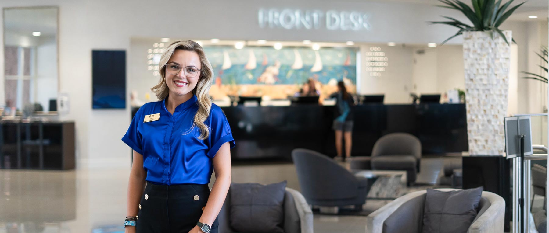 Lenzie Richardson, who graduated in hospitality and tourism management from the University of South Alabama, at the Perdido Beach Resort near the front desk, where she is an assistant manager.