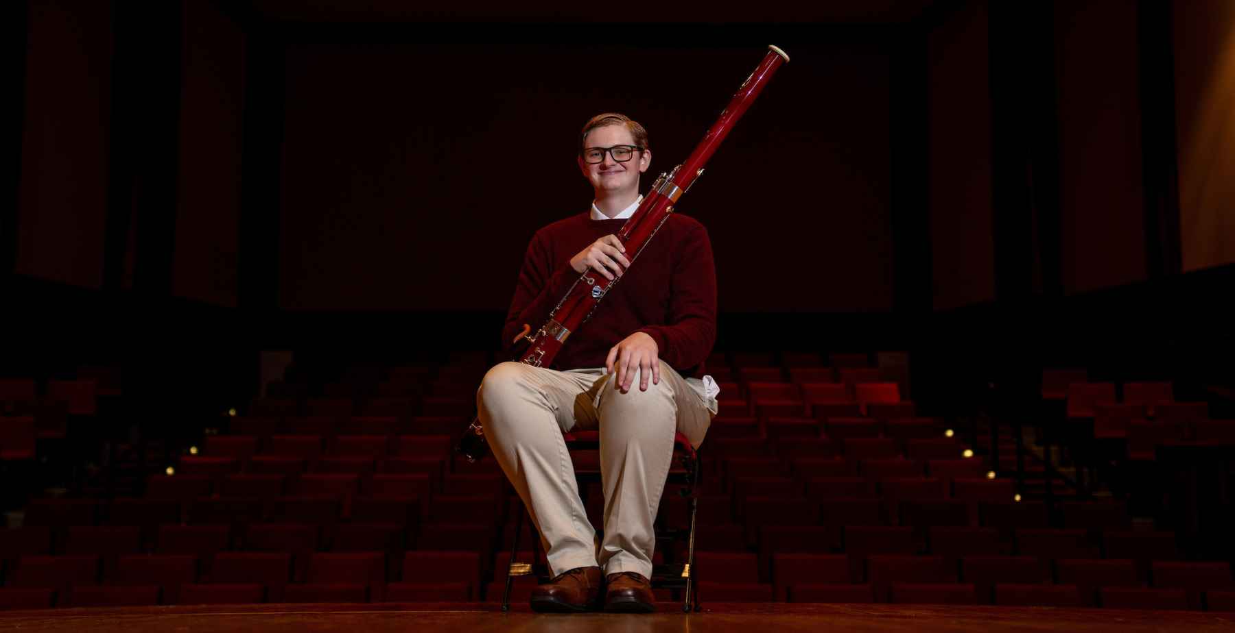 2026-27 Board of Trustees Scholar Ethan Sugg, here on stage at the Laidlaw Performing Arts Center at the University of South Alabama, plans to major in biochemistry and minor in music. 