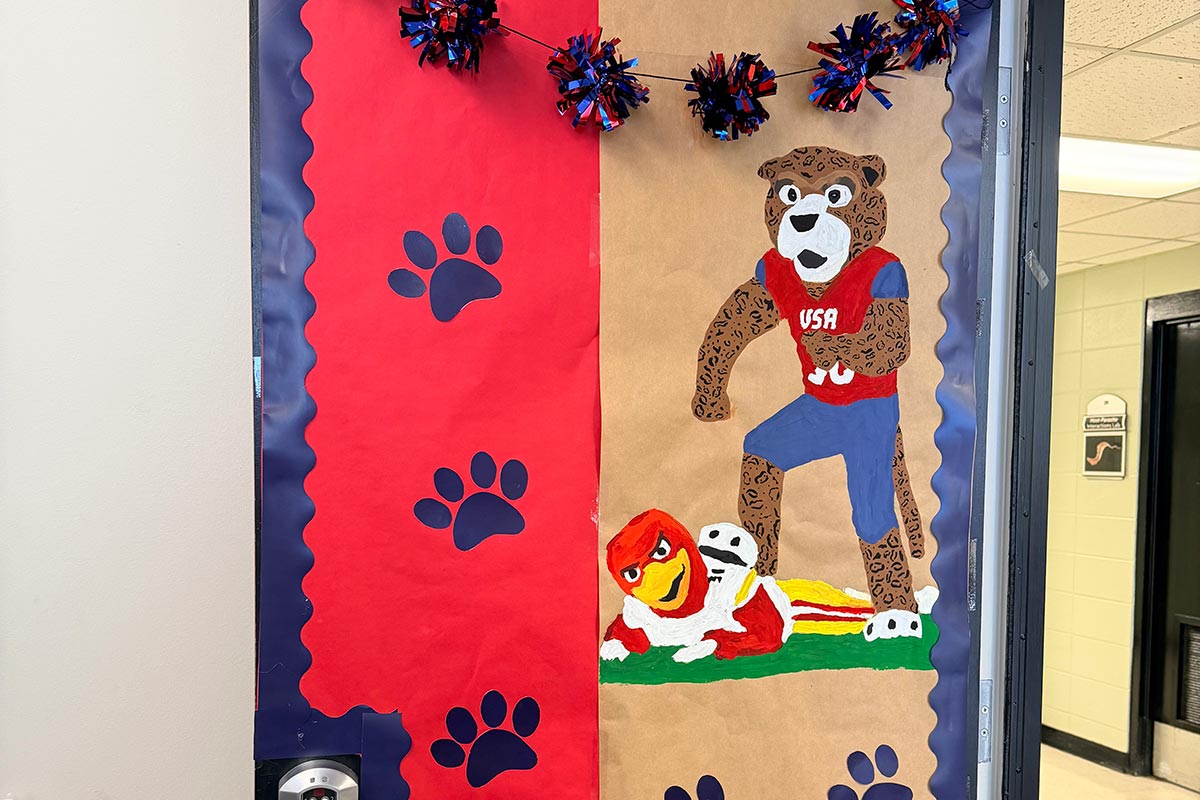 Door decorated for Homecoming with Southpaw stepping on Troy.