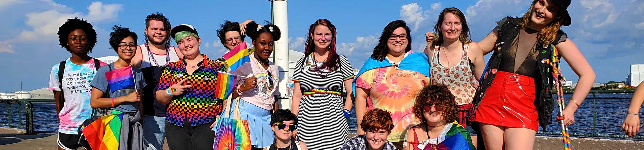 A group of Spectrum students in front of water.